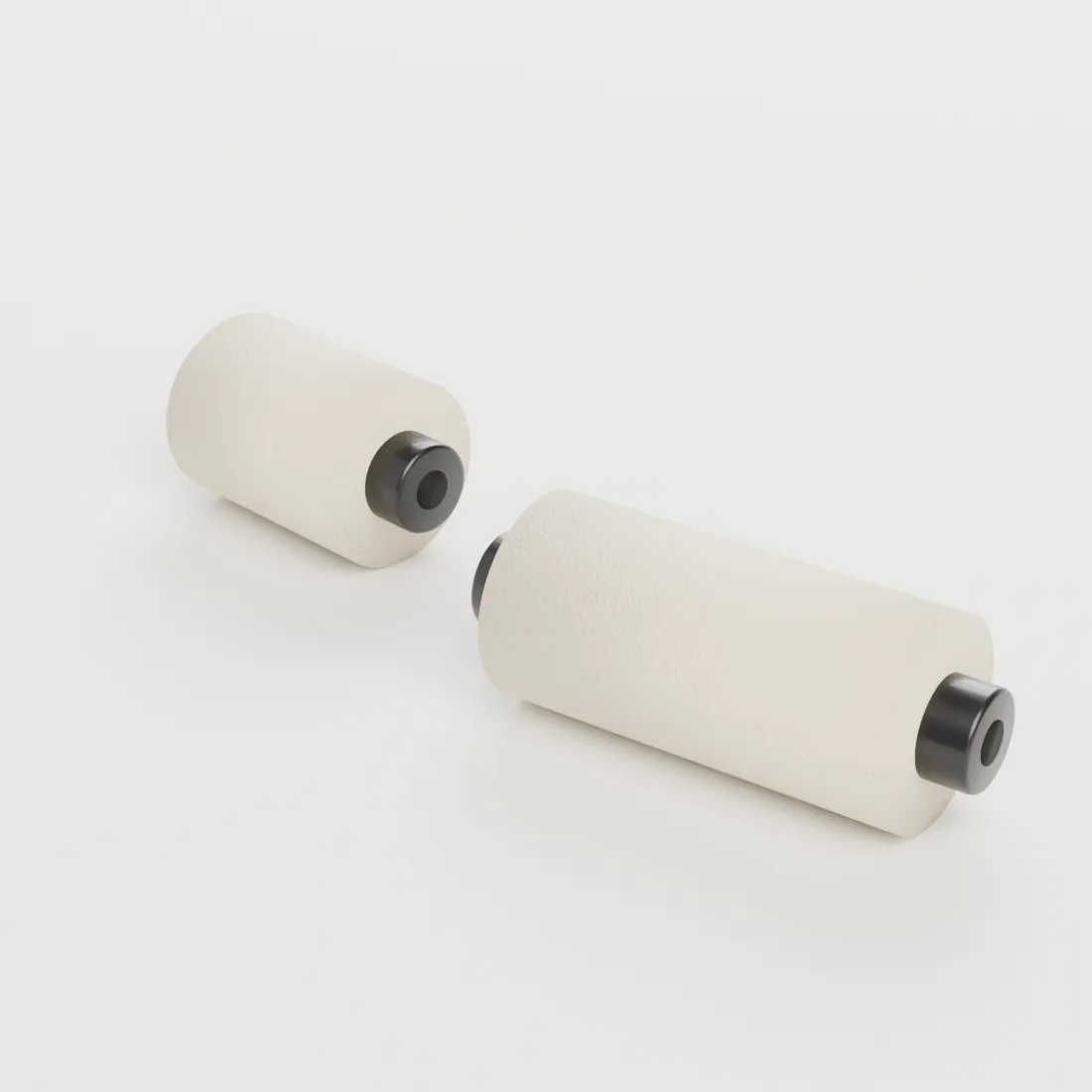 Deux rouleaux encreurs en mousse, 30 et 50 mm, sur leur noyau